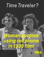 The brief clip of the woman, captioned 'Time traveler in 1938 film' shows a young woman dressed in a stylish 30s dress walking with a crowd of people.